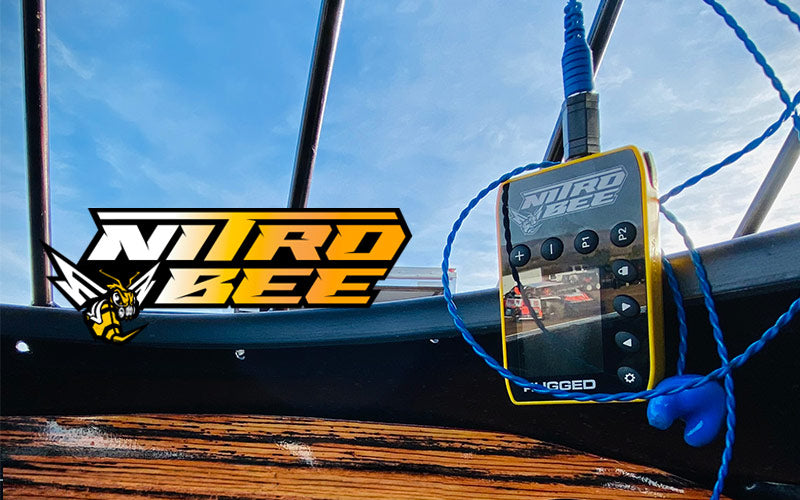 The Nitro Bee Xtreme mounted on a racecar dashboard